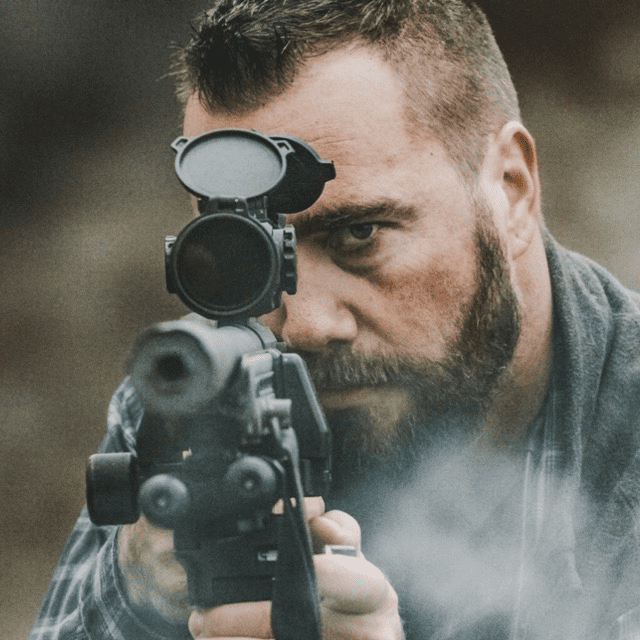 ryan Ryan Cleckner aiming through a scope
